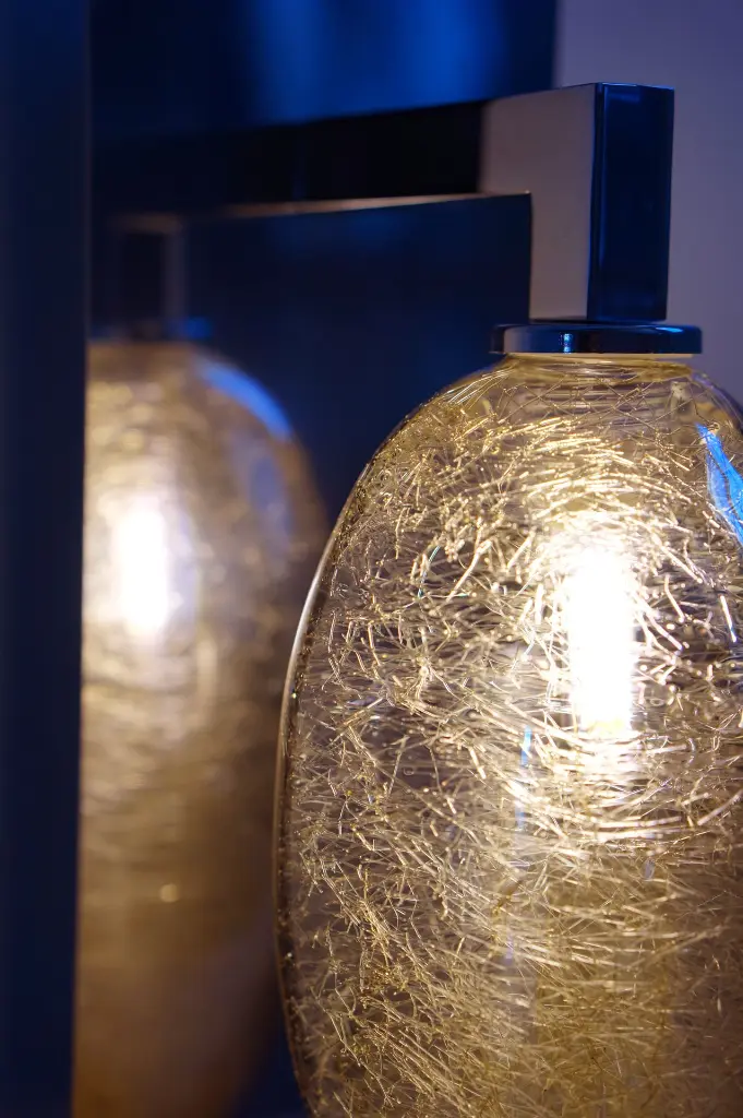 Applique bras miroir galet 01 Airain zoom switchon.webp